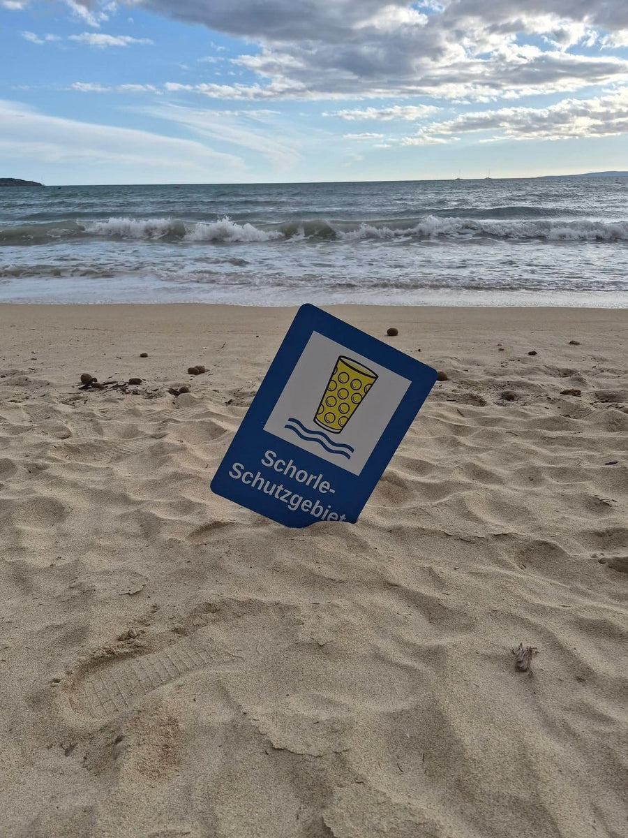 Es Schild im Sand